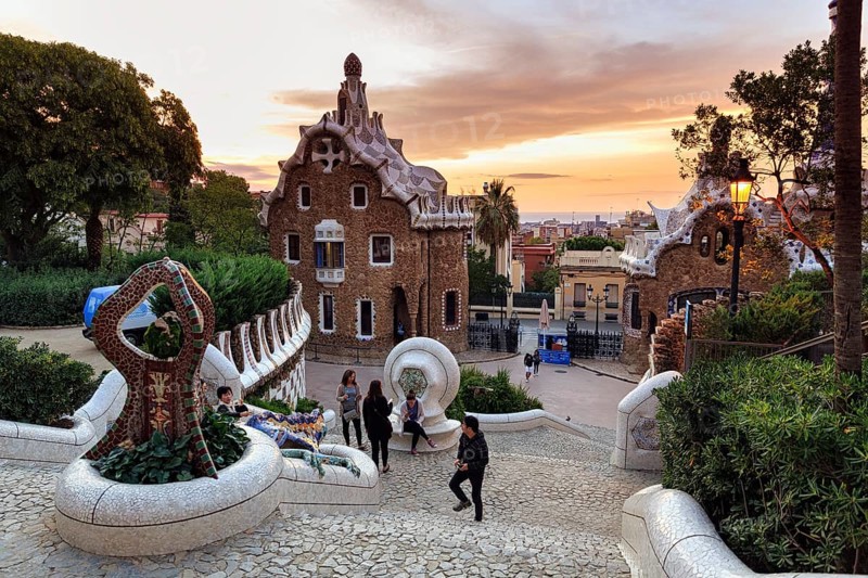 View from the dragon staircase of buildings with colourful mosaics, Park Güell entrance, dawn, Barcelona, Spain, Europe
