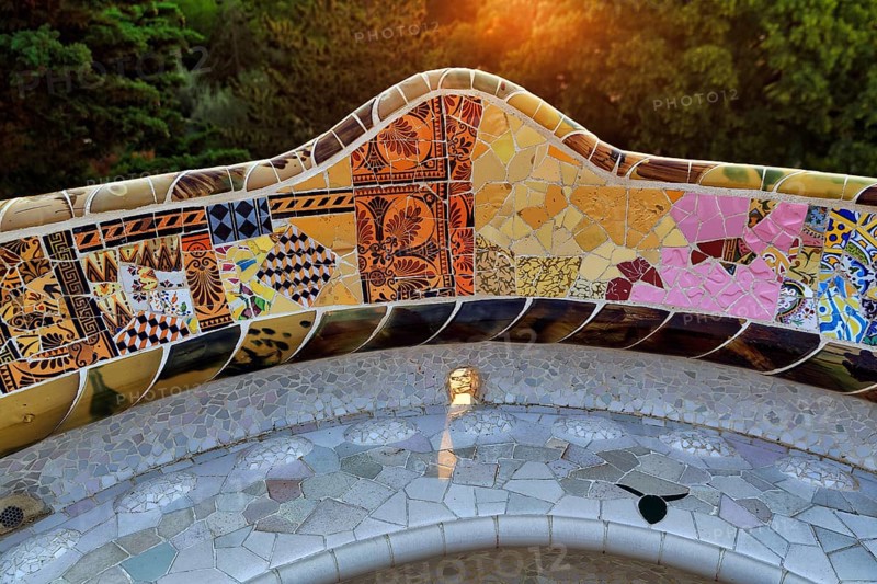 Curved bench, ceramic mosaic, Trencadis, sunrise, Park Güell, Barcelona, SpainTrencadis