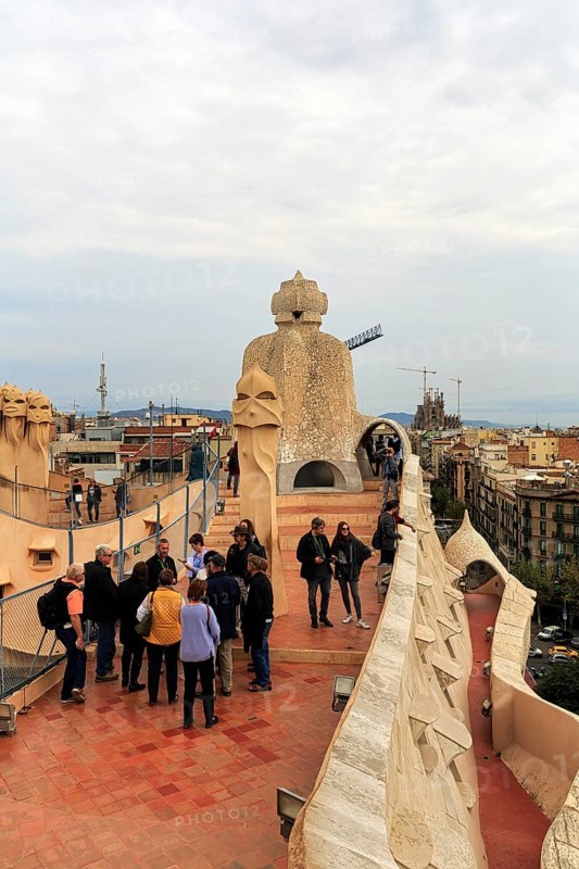 Tourists between artistically designed fireplaces on the large viewing platform, roof terrace in the museum, cultural centre, Casa Mila, Casa Milà, Barcelona, Spain, Europe