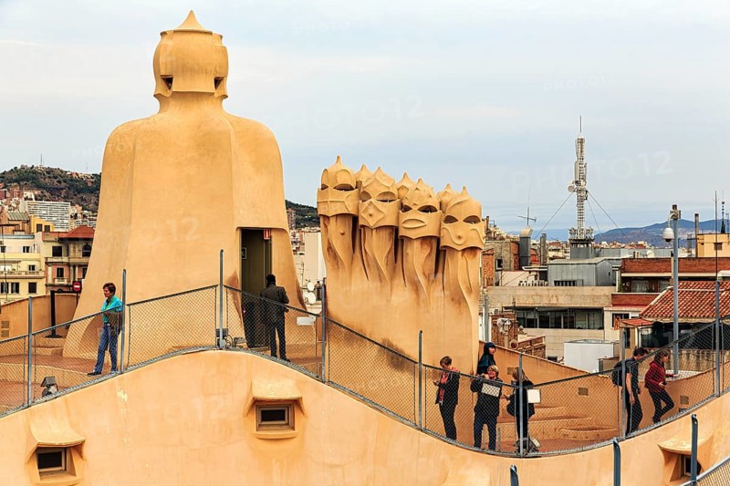 Tourists between artistically designed fireplaces on the large viewing platform, roof terrace in the museum, Garden of the Warriors, cultural centre, Casa Mila, Casa Milà, Barcelona, Spain, Europe