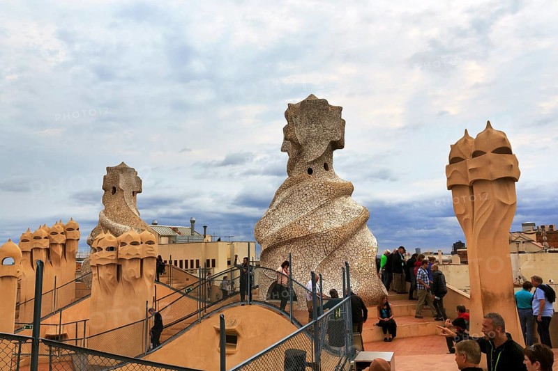Tourists between artistically designed fireplaces on the large viewing platform, roof terrace in the museum, Garden of the Warriors, cultural centre, Casa Mila, Casa Milà, Barcelona, Spain, Europe
