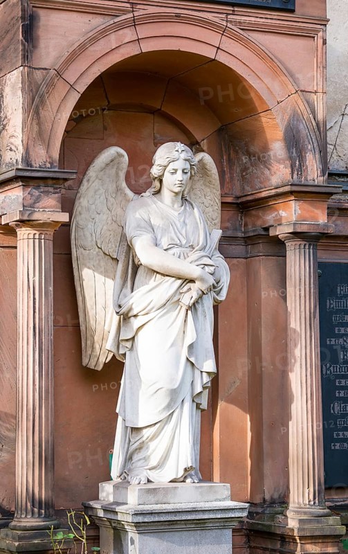 White angel statue with folded arms and spread wings in front of an arch, White, female angel figure, angel statue with star on the crown, finely crafted wings, historical tomb, angel figure, angel statue, angel statue, mourning, condolence, death, transience, cemeteries on Bergmannstraße, Berlin-Kreuzberg, Berlin, Germany, Europe