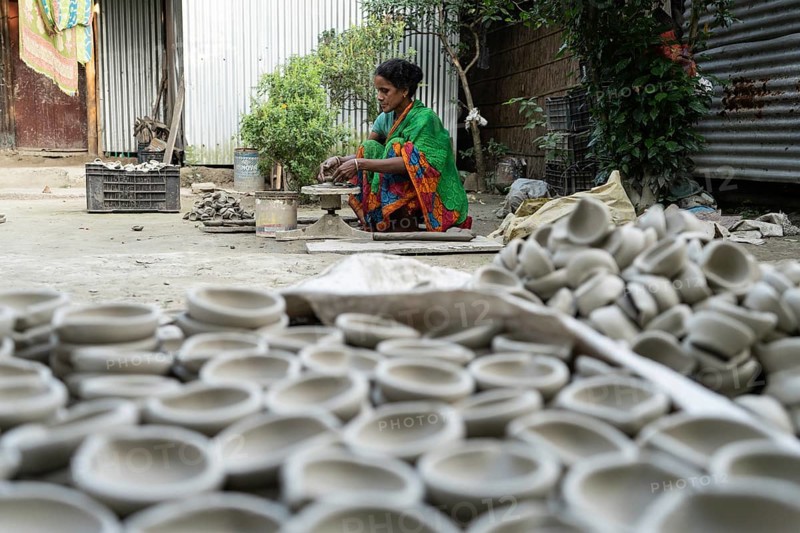 BARPETA, INDIA, NOVEMBER 7: A woman makes earthen lamps or Diyas at her residence ahead of the Diwali Festival in a village in Barpeta, India on November 7, 2023. Earthen lamps are a significant part of Indian culture and tradition