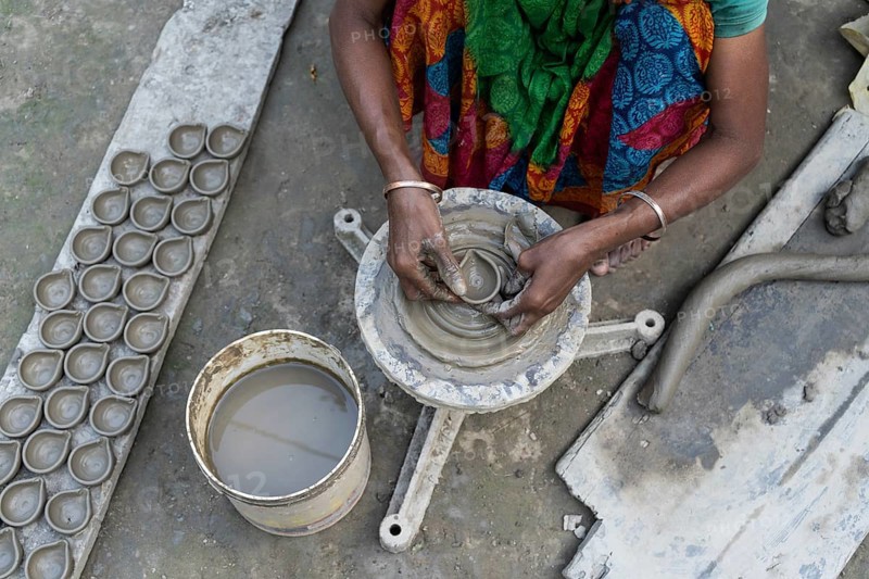 BARPETA, INDIA, NOVEMBER 7: A woman makes earthen lamps or Diyas at her residence ahead of the Diwali Festival in a village in Barpeta, India on November 7, 2023. Earthen lamps are a significant part of Indian culture and tradition