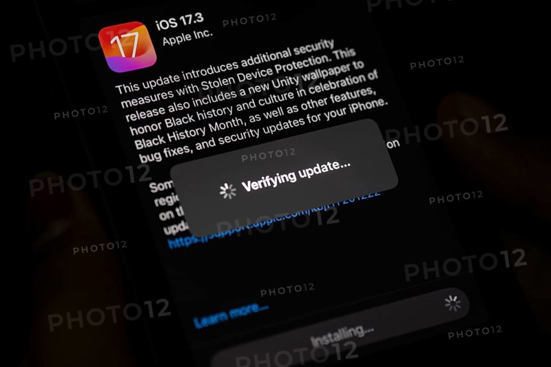 In this photo illustration a person installs updates of iOS 17.3 on an iPhone device on January 26, 2024 in Guwahati, India. Apple has launched a new security feature -Protection for stolen device, to protect personal data, including money apps and personal photos in the new 17.3 iOS update