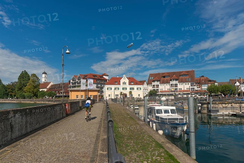 Langenargen on Lake Constance, townscape, harbour, boats, quay wall, St. Martin's Church, zeppelin, Baden-Württemberg, Germany, Europe