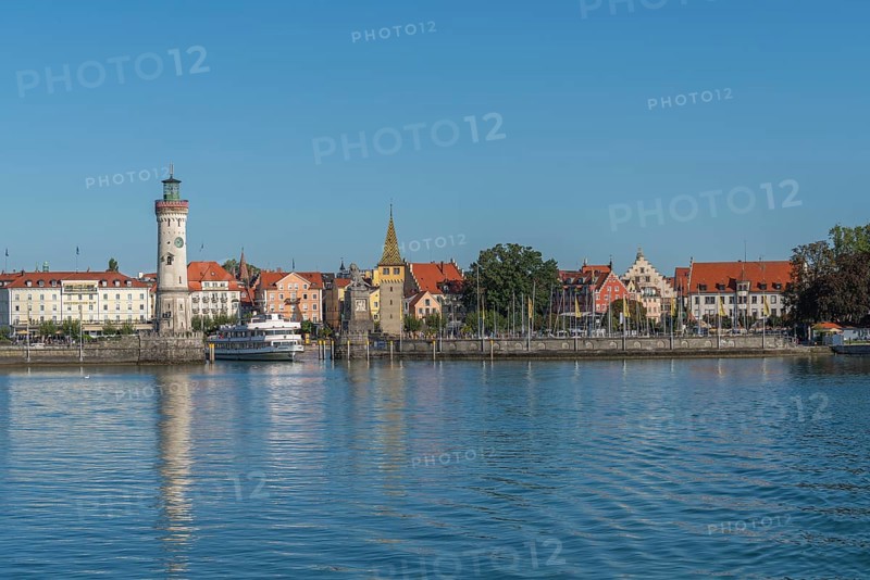 Lindau on Lake Constance, townscape, entrance to the harbour, new lighthouse, man tower, hotels, marina, passenger ship, Bavaria, Germany, Europe