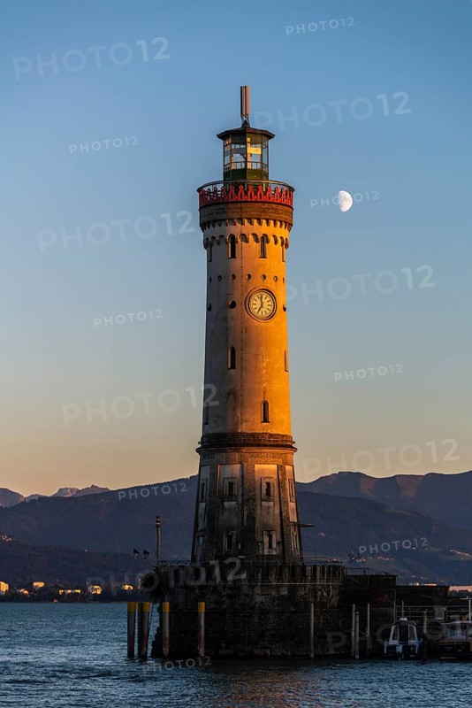 Lindau at Lake Constance, entrance to the harbour, new lighthouse, view of the Alps, half moon, evening light, Bavaria, Germany, Europe