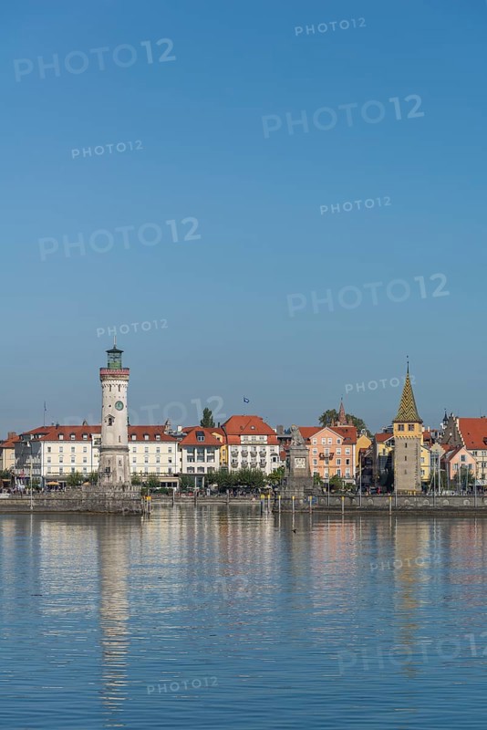 Lindau at Lake Constance, townscape, entrance to the harbour, new lighthouse, man tower, hotels, pier, water reflection, Bavaria, Germany, Europe