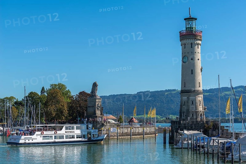 Lindau at Lake Constance, entrance to the harbour, new lighthouse, Bavarian lion, passenger ship, yachts, flags, Bavaria, Germany, Europe