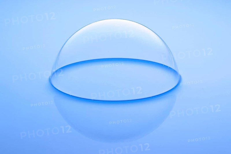 A large soap bubble on light blue water