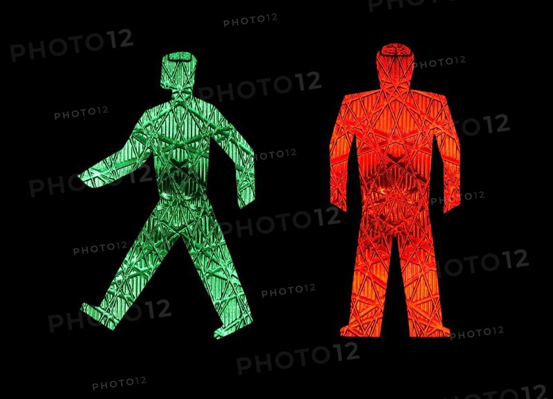 A green traffic light man moves away from a stationary red one, pictograms, pedestrian