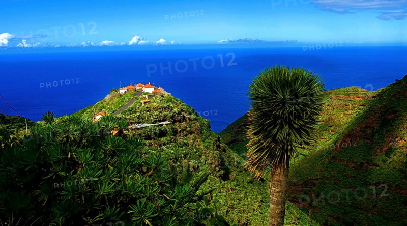 View of a lonely remote farmstead near Barlovento, on the top of a hill with a play of shadows, rugged terrain high above the blue Atlantic, La Palma, Canary Islands, Spain, Europe