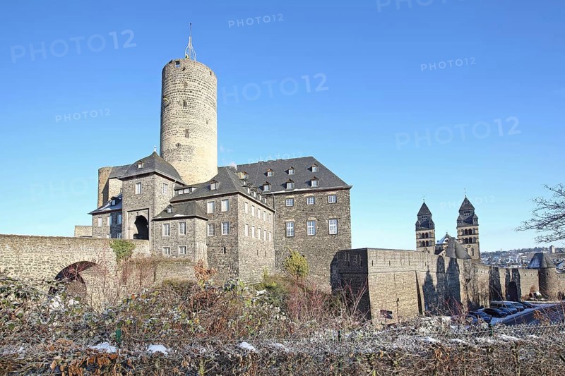 Genoveva Castle built in the 13th century with keep Goloturm, neo-Romanesque Herz-Jesu-Kirche built in 1911 with twin towers and historic town fortifications in winter with snow, town wall, Mayen, Vulkaneifel, Eifel, Rhineland-Palatinate, Germany, Europe