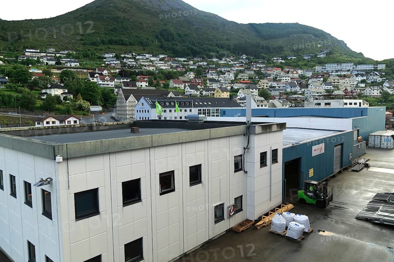 Port buildings and traditional houses in coastal town of Kristiansund, Romsdal county, Norway, Europe