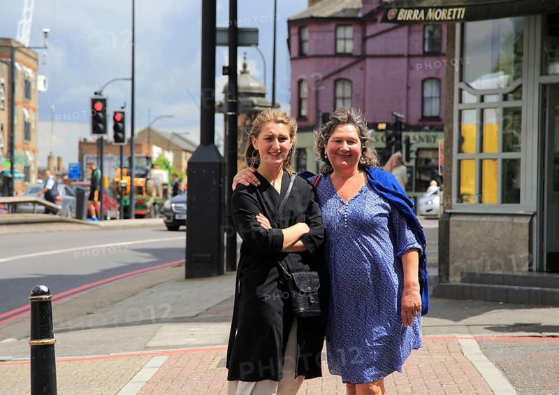 Middle aged mother and her daughter together on street in London, England, UK, model released