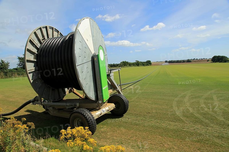 Rainstar E41 irrigation sprayer watering field of grass turf, Alderton, Suffolk, England, UK