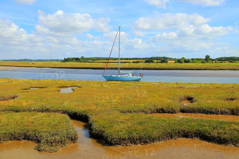 Butley Creek river landscape, Boyton, Suffolk, England, UK yacht at moorings