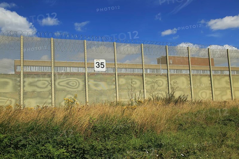 Perimeter fence at Warren Hill prison, Hollesley, Suffolk, England, UK
