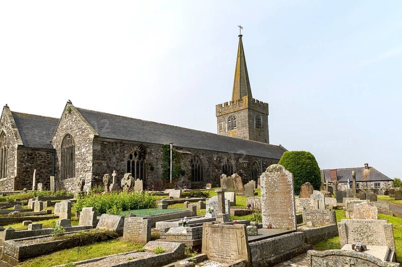 Spire and gravestones village parish church at St Keverne, Lizard Peninsula, Cornwall, England, UK