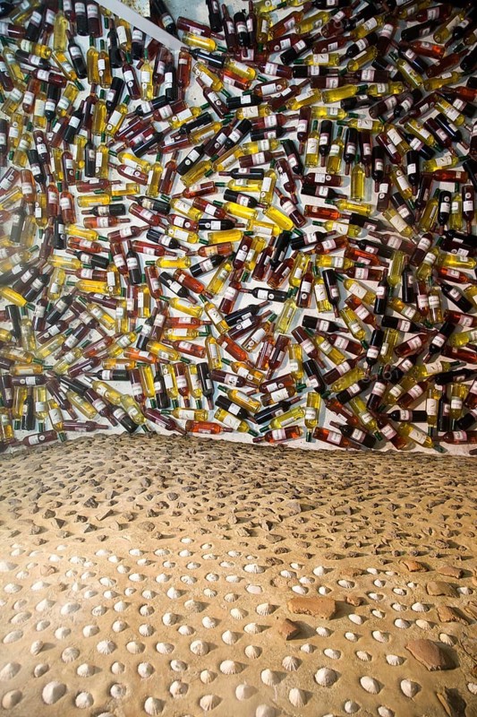 Bottles of wine forming a display in Bodegas Rubicón, La Geria, Lanzarote, Canary Islands, Spain, Europe