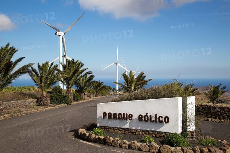 Turbines and sign at Parque Eolico de Lanzarote wind farm, Lanzarote, Canary Islands, Spain, Europe