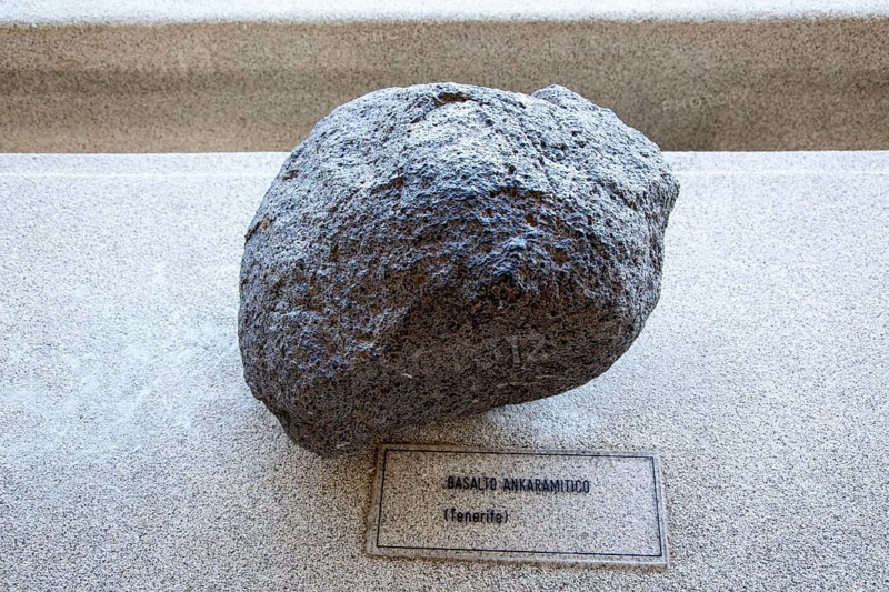 Ankaramite basalt rock sample geology display, Casa de los Volcanes volcanic study centre, Lanzarote, Canary island, Spain, Europe