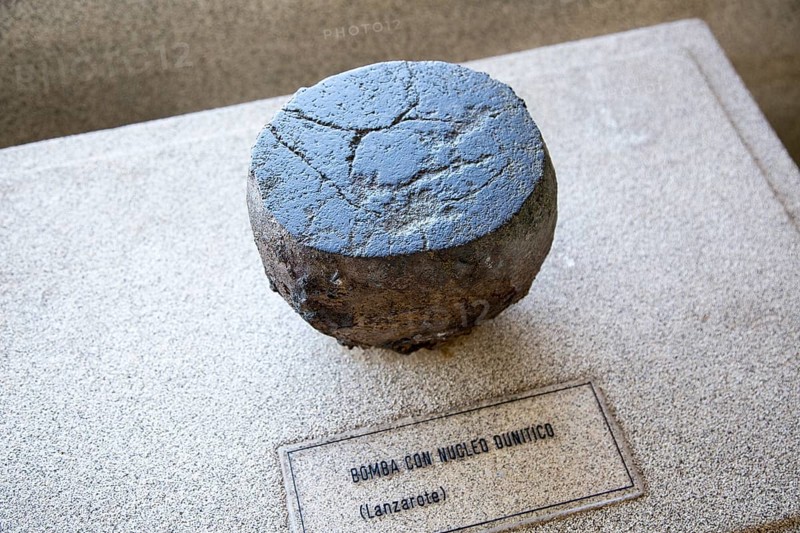 Volcanic bomb rock sample geology display, Casa de los Volcanes volcanic study centre, Lanzarote, Canary island, Spain, Europe