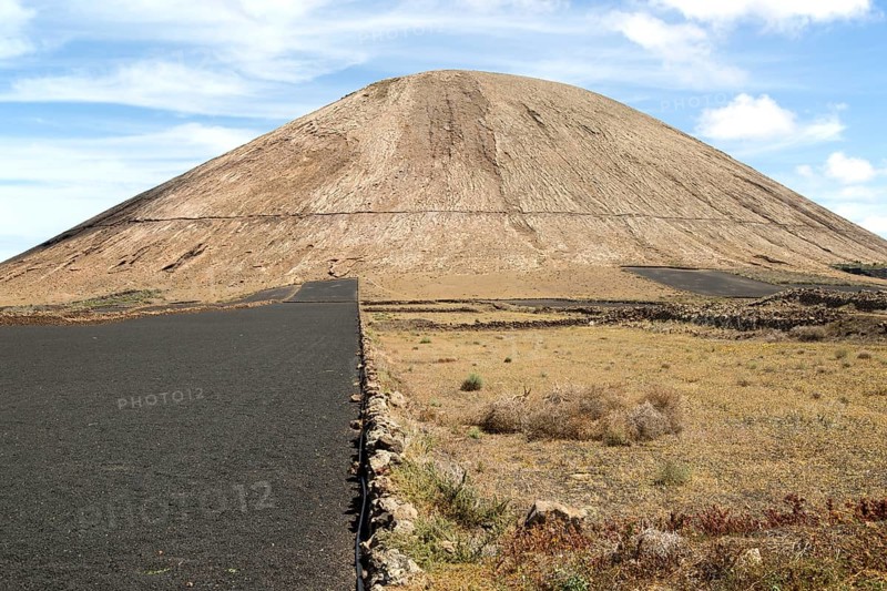 Volcano cone and black volcanic soil farmland, near Tinajo, Lanzarote, Canary Islands, Spain, Montana Tinache, Europe