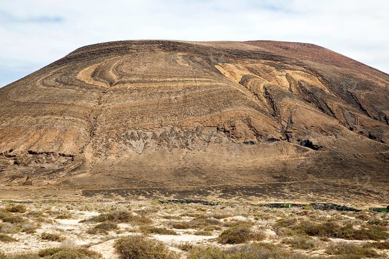 Unusual patterned rock strata on Agujas Grandes volcano, La Isla Graciosa, Lanzarote, Canary Islands, Spain, Europe