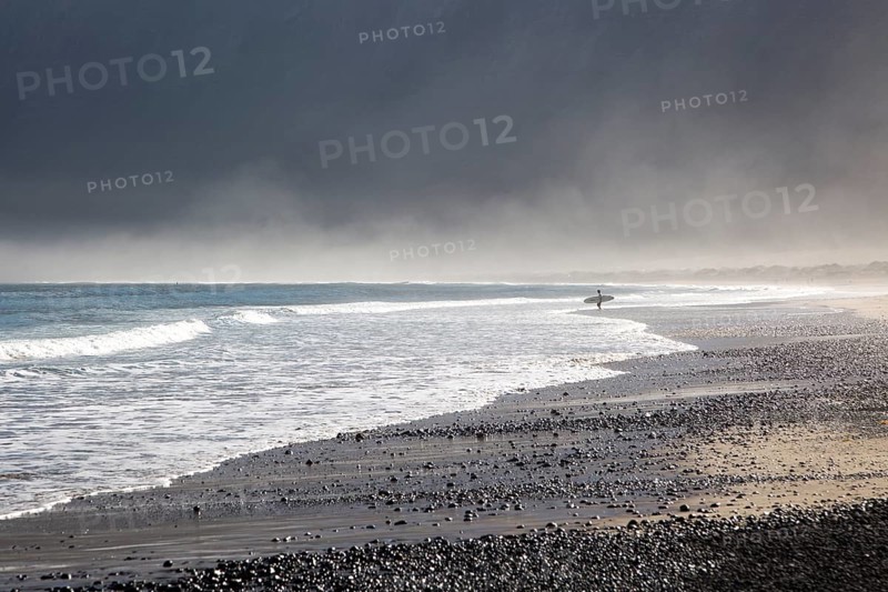 Atlantic Ocean coast beach and waves with morning sea mist, Caleta de Famara, Lanzarote, Canary islands, Spain, Europe