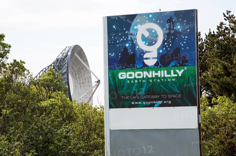 Goonhilly Earth station sign, Lizard peninsula, Cornwall, England, UK, with 'Arthur' the world's first parabolic satellite communications antenna 1962
