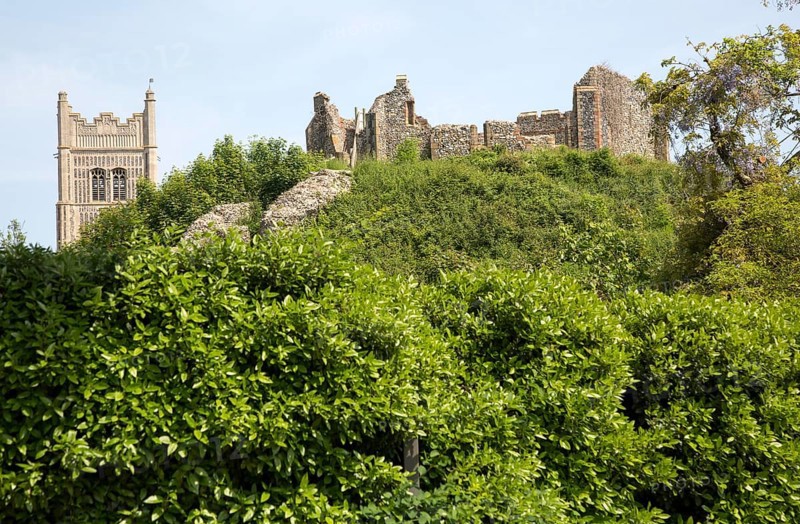Norman motte and bailey castle with Victorian building ruin Eye, Suffolk, England, UK