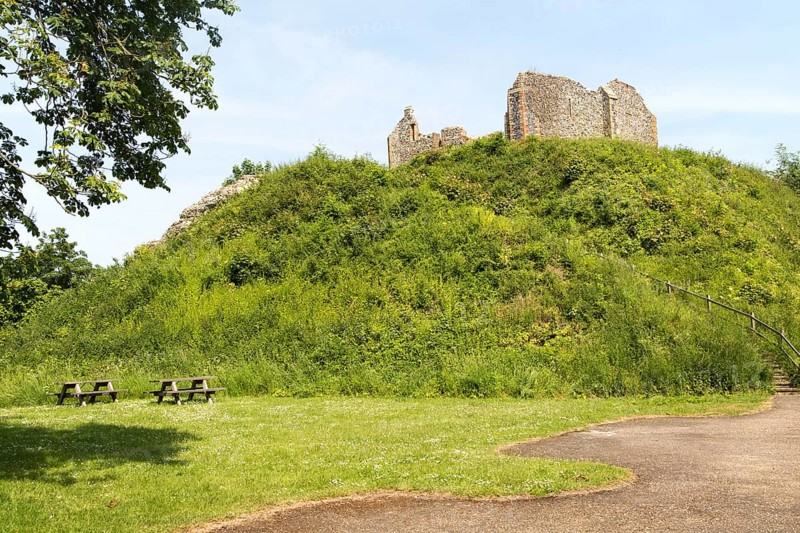 Norman motte and bailey castle with Victorian building ruin Eye, Suffolk, England, UK