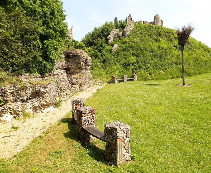 Norman motte and bailey castle with Victorian building ruin Eye, Suffolk, England, UK