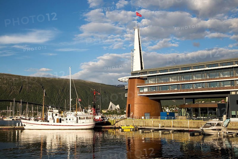 Modern architecture of Scandic Hotel and boats in harbour, city centre of Tromso, Norway, Europe