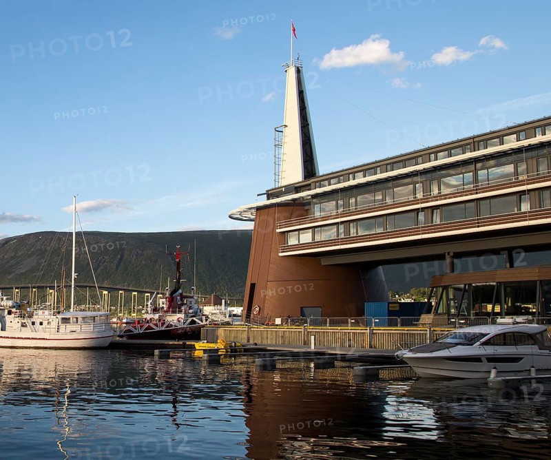 Modern architecture of Scandic Hotel and boats in harbour, city centre of Tromso, Norway, Europe