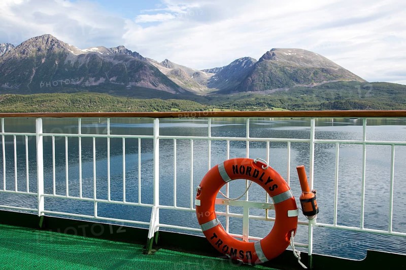 Steep mountains of Grytoya island, Troms county, northern Norway from Hurtigruten ferry ship Nordlys