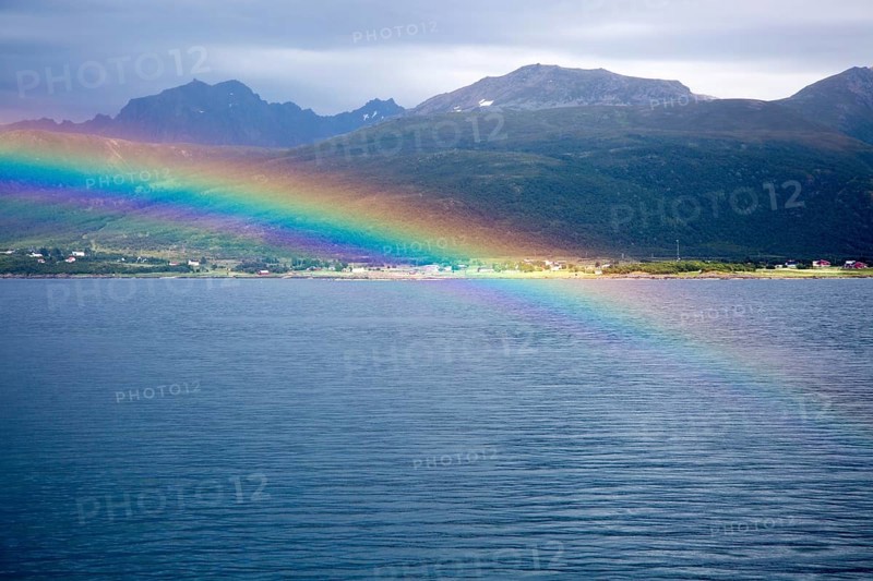 Rainbow over sea near Stokmarknes, Hadsel municipality, Hadseloya island, Nordland, Vesteralen region, northern Norway