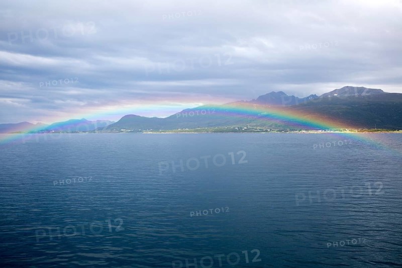 Rainbow over sea near Stokmarknes, Hadsel municipality, Hadseloya island, Nordland, Vesteralen region, northern Norway