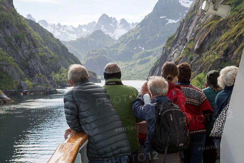 Tourists sightseeing from Hurtugruten ship, Trollfjorden, Lofoten Islands, Nordland, northern, Norway, Europe