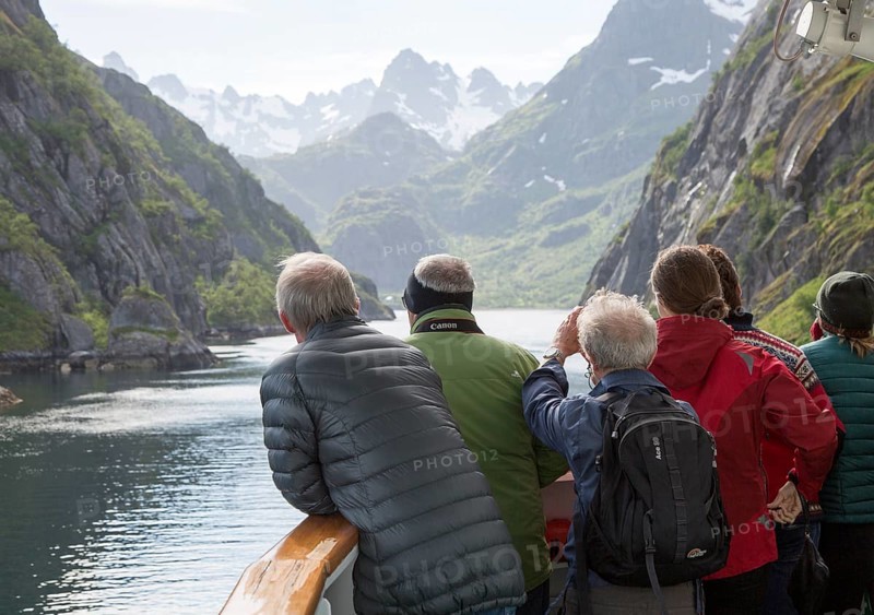 Tourists sightseeing from Hurtugruten ship, Trollfjorden, Lofoten Islands, Nordland, northern, Norway, Europe