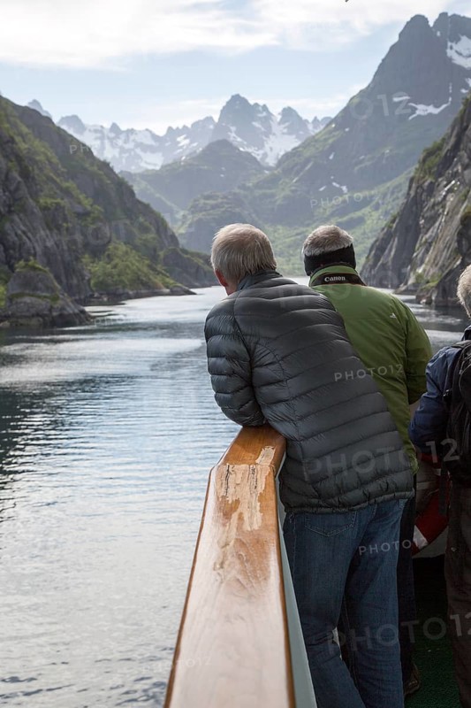 Tourists sightseeing from Hurtugruten ship, Trollfjorden, Lofoten Islands, Nordland, northern, Norway, Europe