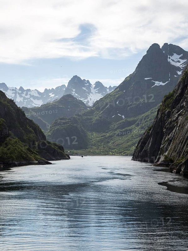 Steep sided glacial trough fiord jagged mountain peaks, Trollfjorden, Lofoten Islands, Nordland, northern, Norway, Europe