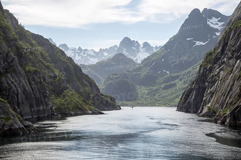 Steep sided glacial trough fiord jagged mountain peaks, Trollfjorden, Lofoten Islands, Nordland, northern, Norway, Europe