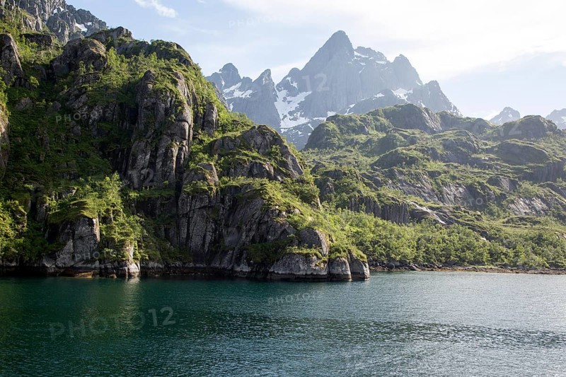 Steep sided glacial trough fiord jagged mountain peaks, Trollfjorden, Lofoten Islands, Nordland, northern, Norway, Europe