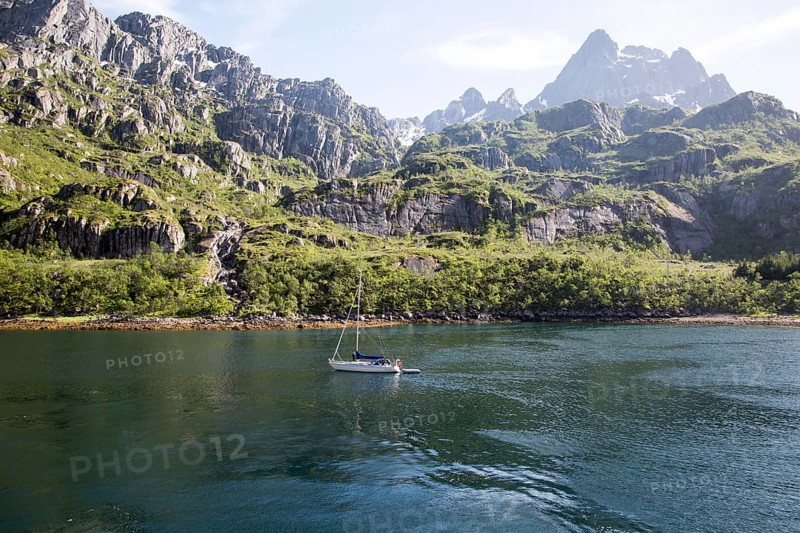 Steep sided glacial trough fiord jagged mountain peaks, Trollfjorden, Lofoten Islands, Nordland, northern, Norway, Europe
