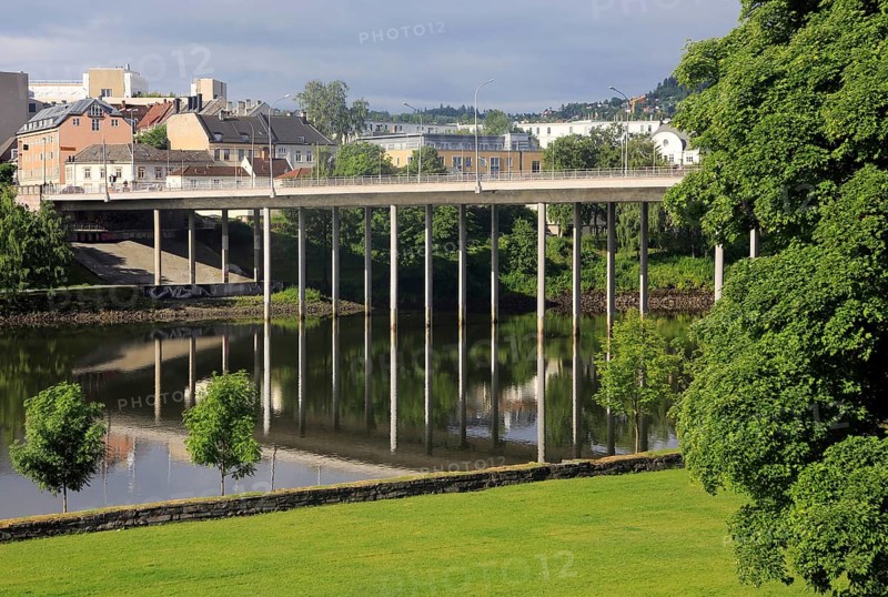 Elgeseter Bridge reflected in water of Nidelva river, Trondheim, Norway, Europe