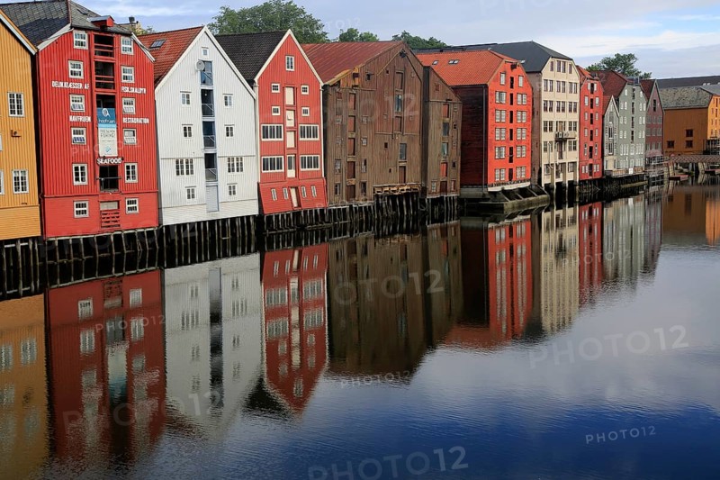 Historic waterside warehouse buildings on River Nidelva, Bryggene, Trondheim, Norway, Europe