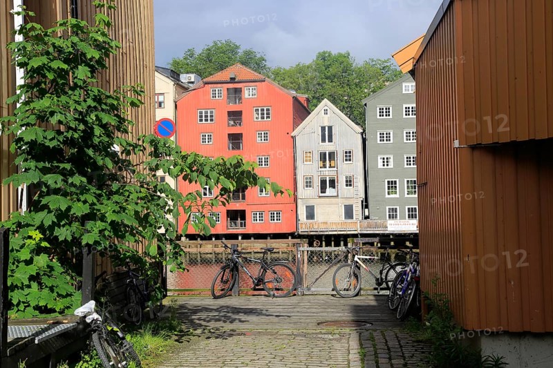 Historic waterside warehouse buildings on River Nidelva, Bryggene, Trondheim, Norway, Europe